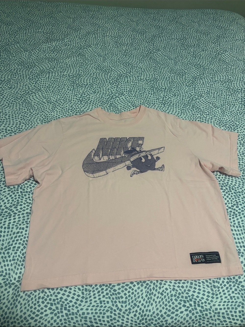 Woman’s Nike Pink Graphic Logo Tee